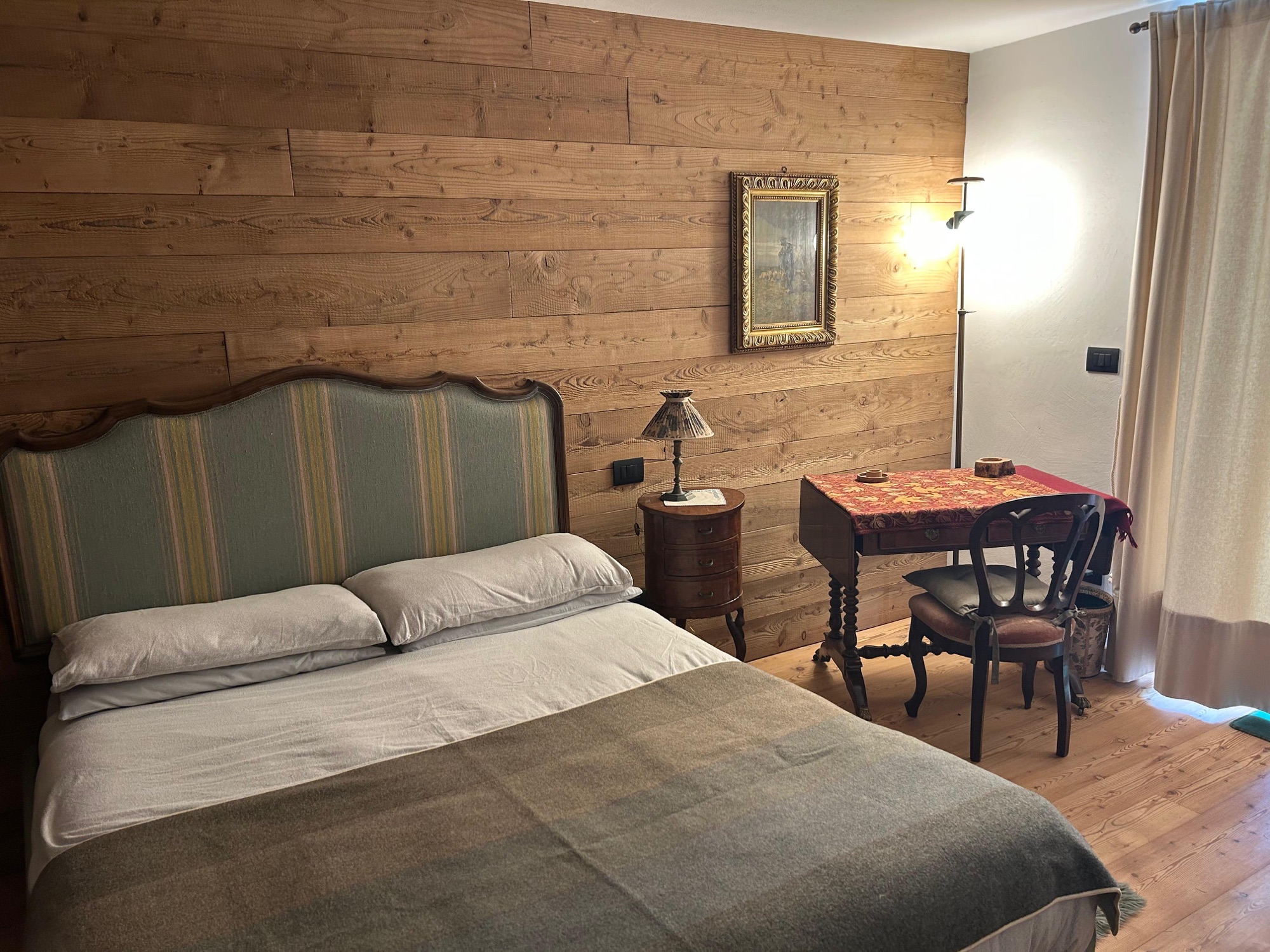 Master bedroom with wooden walls